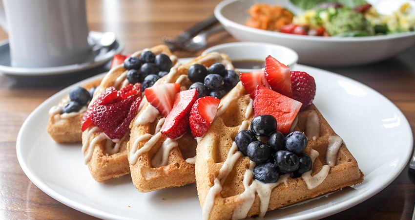 Paleo Waffles with cashew cream and maple syrup